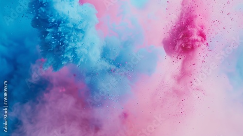 Close-up of blue and pink colored powder clash in the air