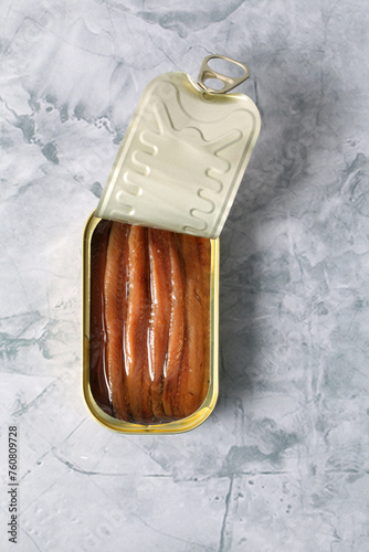 Can of anchovies in olive oil isolated on close-up