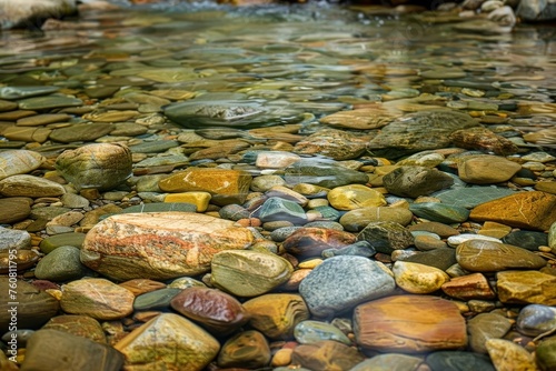 Crystal clear mountain stream with smooth pebbles Perfect for themes of purity Nature And environmental conservation