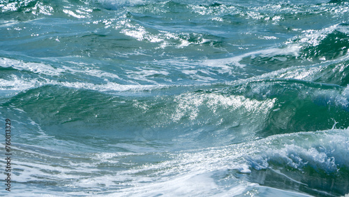 Foamy sea waves in strong winds.