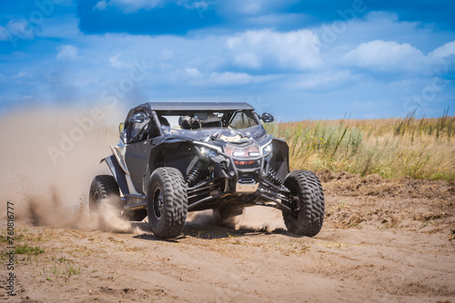 UTV in action offroad vehicle racing on sand dune. Extreme, adrenalin. 4x4.