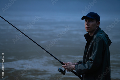 Man fishing on the mountain river at evening © scharfsinn86