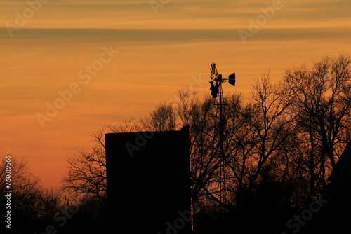 Farm Windmill silhouette at Sunset in Kansas