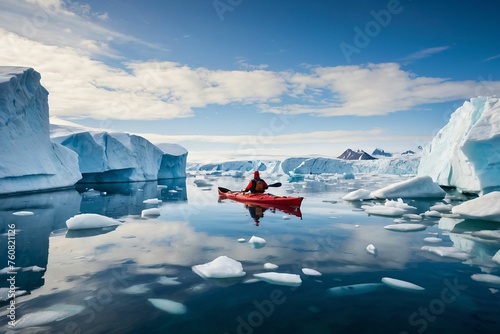 Panoramic view of an ecologist tourist in an inflatable boat. A researcher in a red kayak against a background of glaciers and an iceberg in Antarctica. Study of global warming at the north pole photo