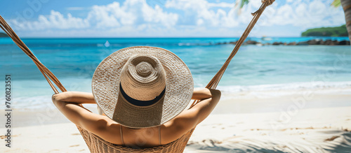 a woman relaxes and enjoys the sun on vacation at the beach in a wicker hammock, Generative AI.