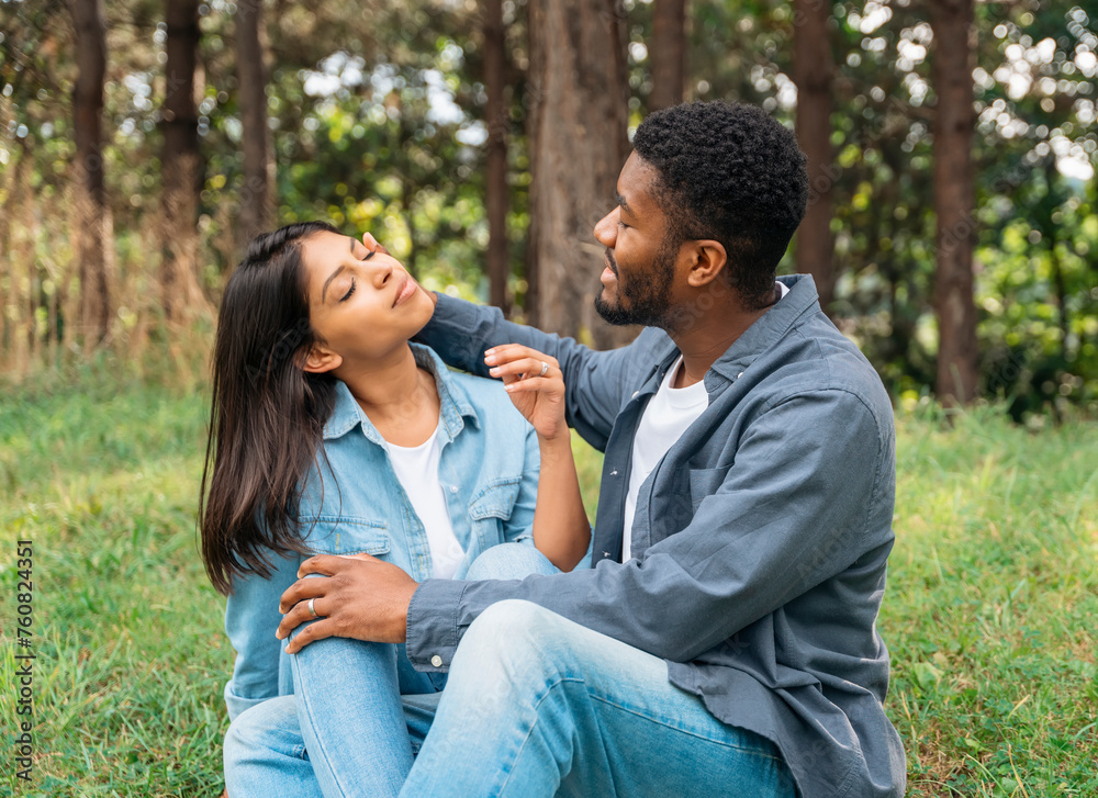 A handsome man and beautiful woman hugging each other, felling in love and spending time in the park Time together A handsome man and beautiful woman hugging each other, felling in love and spending time in the park Time together