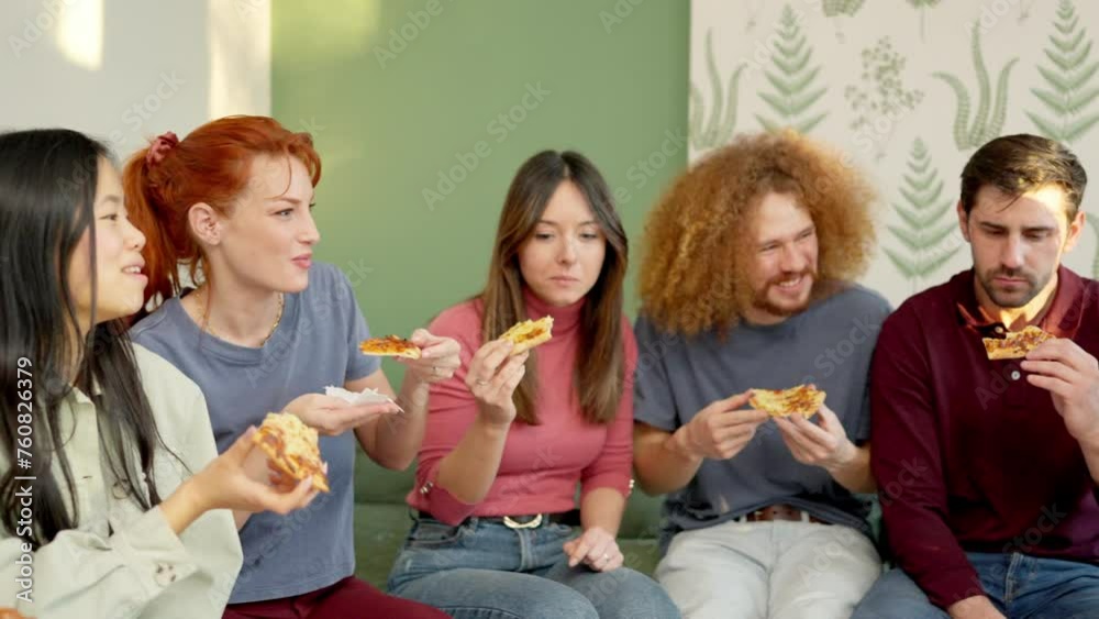 Friends chilling and smiling eating pizza together at home Friends chilling and smiling eating pizza together at home