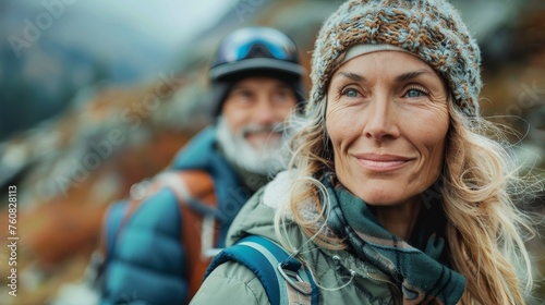50 year old mordern woman and man with backpacks hiking trekking on mountains.  Seniors active healthy lifestyle adventure journey vacations. Generative ai photo