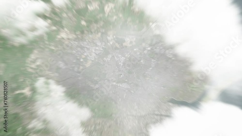 Earth zoom in from space to Finglas, Ireland. Followed by zoom out through clouds and atmosphere into space. Satellite view. Travel intro. Images from NASA photo