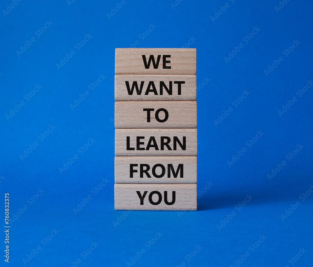 We want to learn from you symbol. Wooden blocks with words We want to learn from you. Beautiful blue background. Business and We want to learn from you. Copy space.