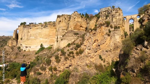 Panoramic view of Puente Nuevo Bridge on sunny day in Ronda, Spain