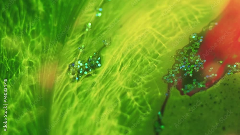 Neon fluid wave. Paint mix water. Vivid glowing green yellow pink color glitter texture ink drop blend flow art abstract background. Neon fluid wave. Paint mix water. Vivid glowing green yellow pink color glitter texture ink drop blend flow art abstract background.