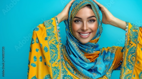 Radiant asian muslim woman smiling, wishing eid mubarak on pastel background with copy space