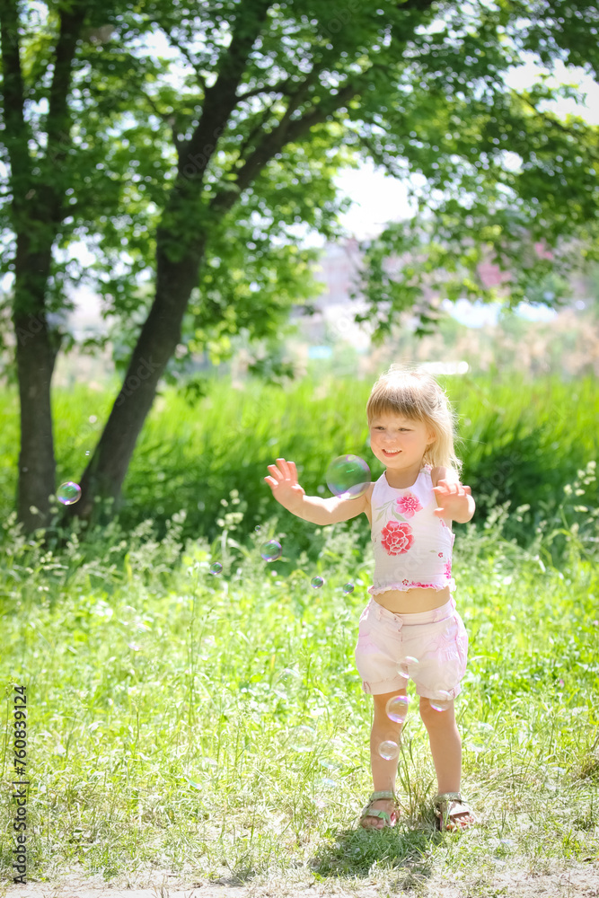 happy child having fun playing in the nature park happy child having fun playing in the nature park