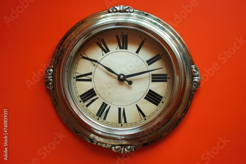 Vintage wall clock on a red background