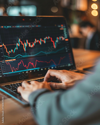 man checking stock market charts on the laptop, hands close up