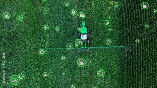 Autonomous self driving tractor with green, sustainable icons. Top down aerial Graphic 3D overlay concept. The future of technology farming photo