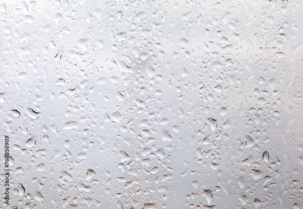 Rain drops on a window, close up Rain drops on a window, close up