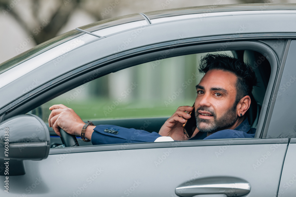 driver talking on mobile phone in the car