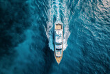 Drone perspective capturing a luxurious tourist boat from above. Perfect for travel magazines, cruise line promotions, or vacation destination websites