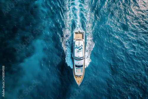 Drone perspective capturing a luxurious tourist boat from above. Perfect for travel magazines, cruise line promotions, or vacation destination websites © Yana