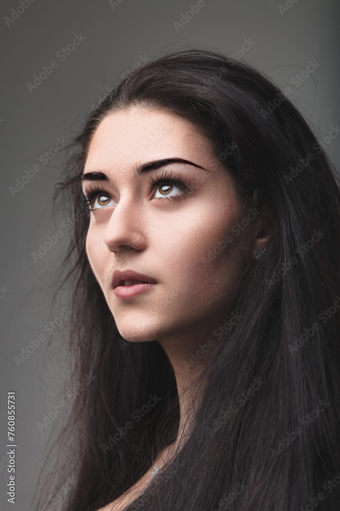 Woman's thoughtful glance evokes profound inner strength Woman's thoughtful glance evokes profound inner strength