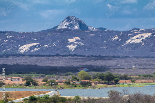 Countryside landscape with Pedra do Pico in the background, a point of attraction in the city of Taperoá, in northeastern Brazil.