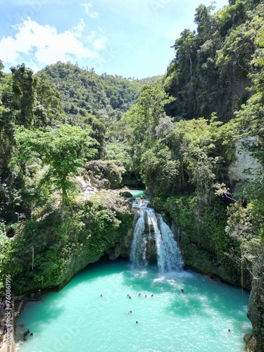 Multi-tier Kawasan falls with waterfall Blue lagoons amid tropical jungle. Aerial