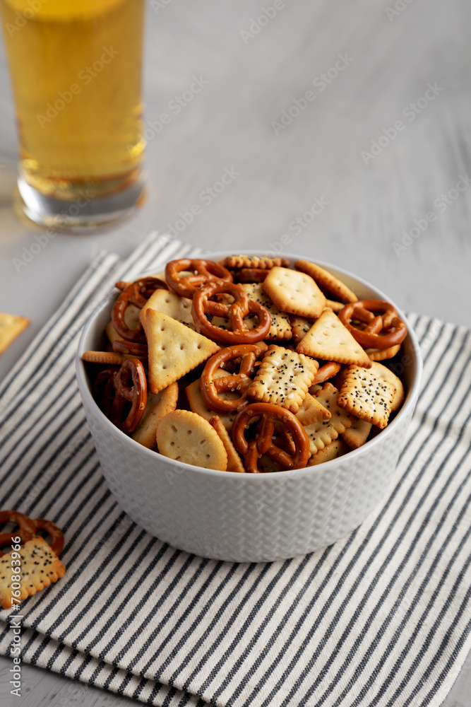 Homemade Cracker Snack Mix with Pretzels in a Bowl, side view. Homemade Cracker Snack Mix with Pretzels in a Bowl, side view.