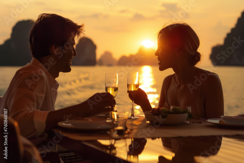Romantic Dinner for Two Overlooking the Sea at Sunset with Warm Light Reflecting on the Water