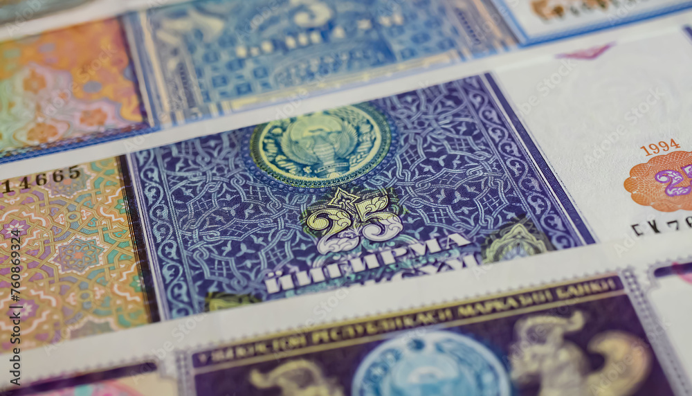 Closeup of old Uzbekistan Sum currency banknote issued in 90s with National emblem and Islamic pattern