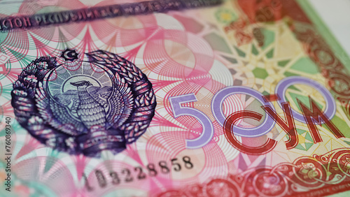 Closeup of old Uzbekistan 500 Sum currency banknote issued 1999 with national emblem photo