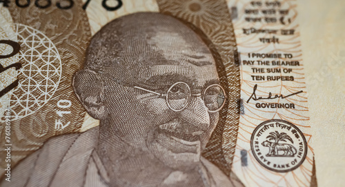 Closeup portrait of Mahatma Gandhi on India old rupee currency banknote