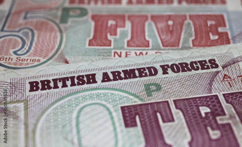 Obraz premium Closeup of old historical British Armed Forces banknotes (focus on center)