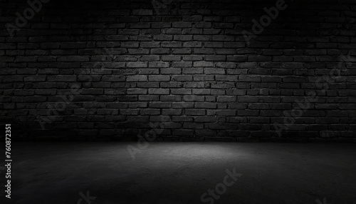 A  black brick wall with black textured background and light shining on it  for product presentation  template  banner or presentation page and web banner