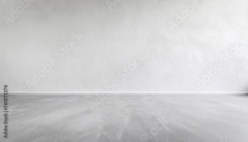 A white wall with a lot of small white dots on it. The wall is empty and has no furniture or decorations © Aleksandr Matveev