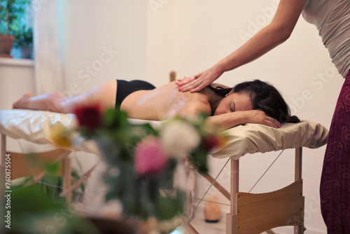 Physiotherapy and massage of woman in spa salon. Natural therapy of body and massaging female . 