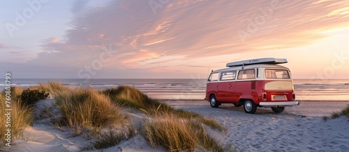 A camping van bus with a surf board photo