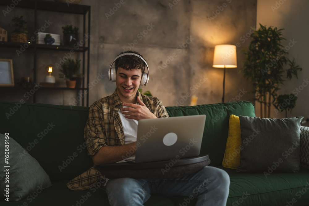 One caucasian teenager man use laptop computer have video call at home