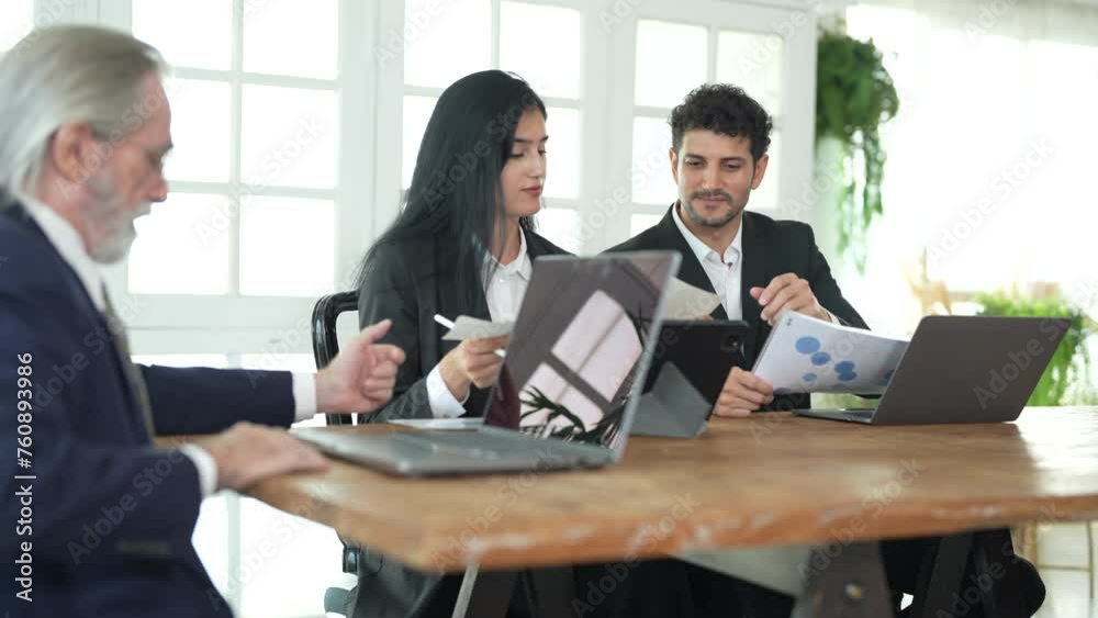 Corporate business team and manager in meeting. Diversity of business people of African and Latin women and Caucasian men are working together. Senior boss are consulting team at clean interior room. Corporate business team and manager in meeting. Diversity of business people of African and Latin women and Caucasian men are working together. Senior boss are consulting team at clean interior room.