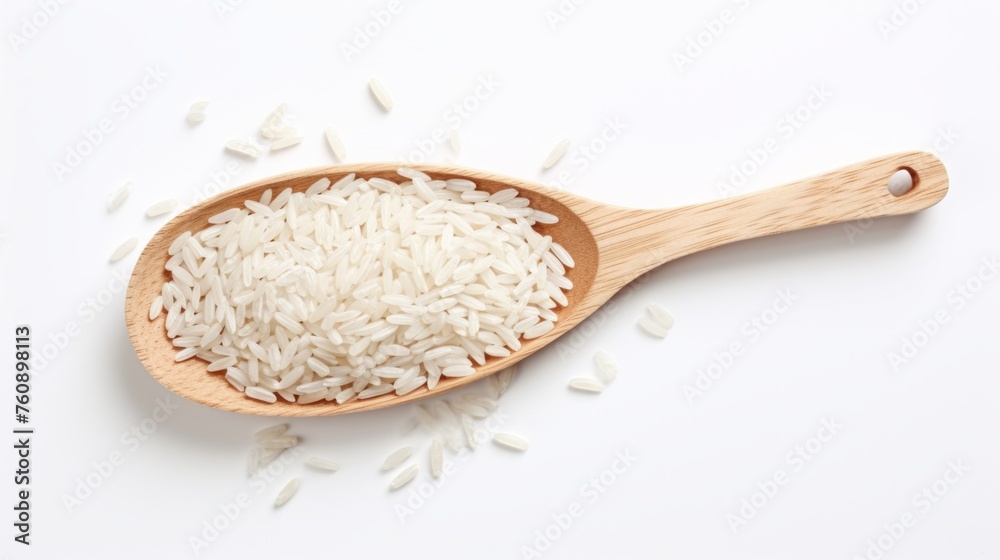 Grains of uncooked white rice in a wooden spoon. On a clean white background. Top view. Concept of food, cooking ingredient, healthy nutrition, cereal grain, and agricultural product.