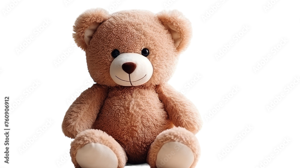 A brown teddy bear sits up against a plain white background