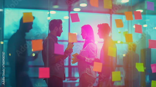 A group of professionals brainstorming with sticky notes on a glass wall, in a brightly lit office, business persons, with copy space