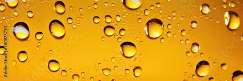 Close-up of Yellow Water Drops Background with Reflections