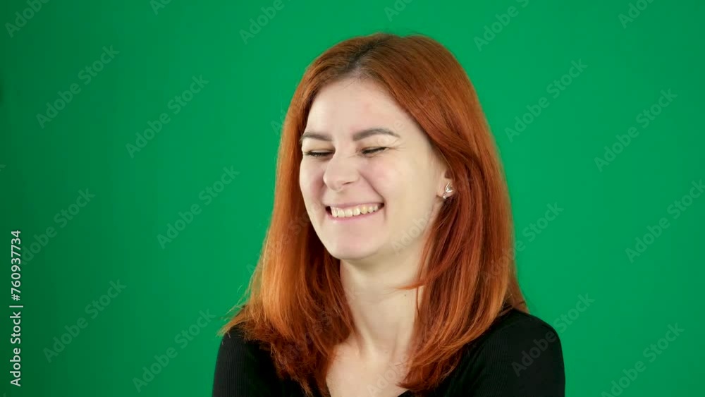 Red-haired girl Satisfied, smiling, closing her eyes, happy, hugging herself by the shoulders face.