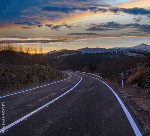 Asphalt road curve and autumn sunset Mountains, Ukraine, Carpathian.