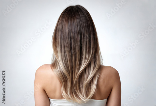 Stylish Balayage on Curly Hair Over Woman's Shoulders