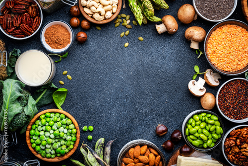 Vegan food background with empty space. Plant protein., vegetarian nutrition sources. Healthy eating, diet ingredients: legumes, beans, lentils, nuts, soy milk, tofu, cereals, seeds and sprouts. 