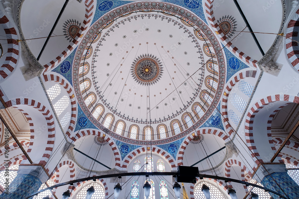 central dome of the Rüstem Mosque in the downtown area of Istanbul, famous for its decorated blue tiled walls and red and white painted arches