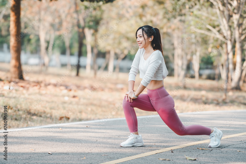 Active young woman stretching during an outdoor workout session in a park, showcasing a healthy lifestyle and fitness routine. Active young woman stretching during an outdoor workout session in a park, showcasing a healthy lifestyle and fitness routine.